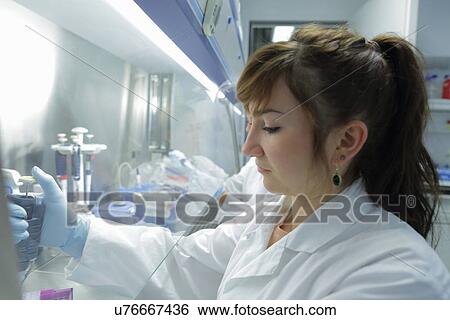 Stock Photograph - Biology lab technicians at work. Fotosearch