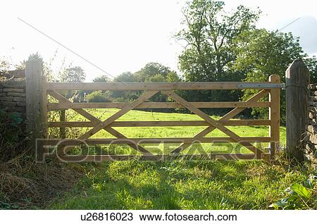 Stock Image - Boundary gate between fields. Fotosearch