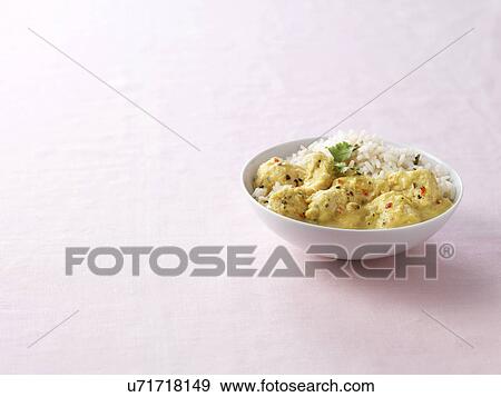 Bowl of lemon chicken and apricot curry with steamed rice View Large Photo Image Stock Photo - Bowl of lemon chicken and apricot curry with steamed rice. Fotosearch