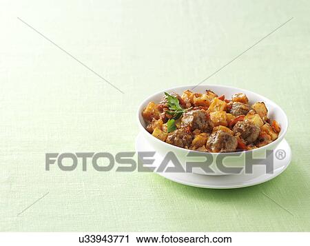 Bowl of Spanish meatballs with paprika and chorizo potatoes View Large Photo Image Stock Image - Bowl of Spanish meatballs with paprika and chorizo potatoes. Fotosearch