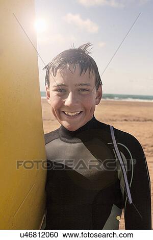 Boy with surfboard View Large Photo Image Stock Image - Boy with surfboard. Fotosearch