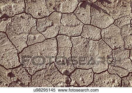 Close up of dried cracked soil View Large Photo Image Stock Photography - Close up of dried cracked soil. Fotosearch