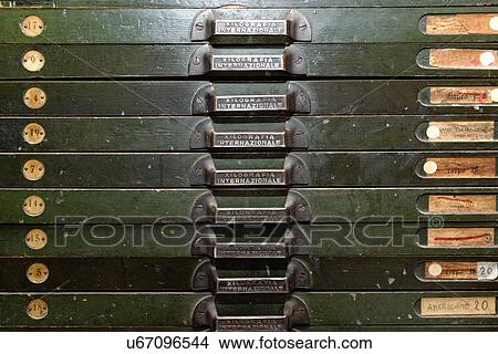 Picture - Close up of letterpress drawers in traditional bookbinding workshop. Fotosearch