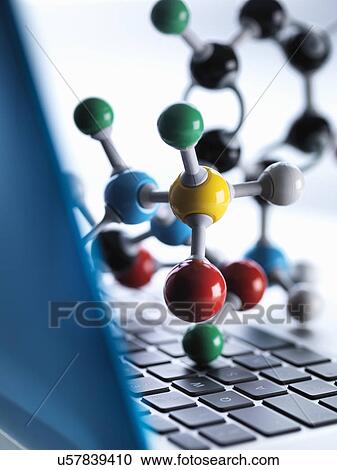 Close up of molecular model sitting on top of lap top computer keyboard to illustrate science education and computer aided research View Large Photo Image Stock Image - Close up of molecular model sitting on top of lap top computer keyboard to illustrate science education and computer aided research. Fotosearch