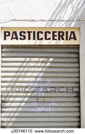 Closed shutters, Pasticceria, Borgomanero, Novara, Italy View Large Photo Image Stock Image - Closed shutters, Pasticceria, Borgomanero, Novara, Italy. Fotosearch