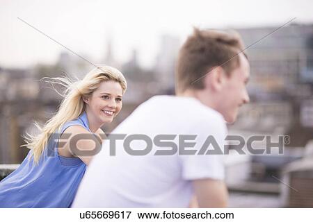 Couple, focus on young woman View Large Photo Image Stock Photo - Couple, focus on young woman. Fotosearch