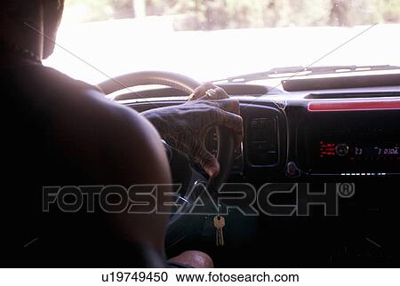 Cropped close up of young man driving on car road trip View Large Photo Image Stock Image - Cropped close up of young man driving on car road trip. Fotosearch