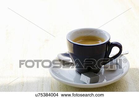Cup of espresso on cafe table View Large Photo Image Picture - Cup of espresso on cafe table. Fotosearch