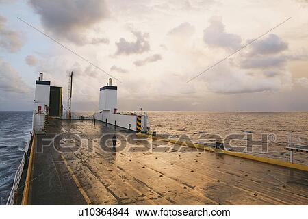 Picture - Distant view of small group of passengers on ferry deck, Mersin, Turkey. Fotosearch