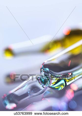 Stock Photo - Drug ampoules sitting in tray awaiting injection. Fotosearch