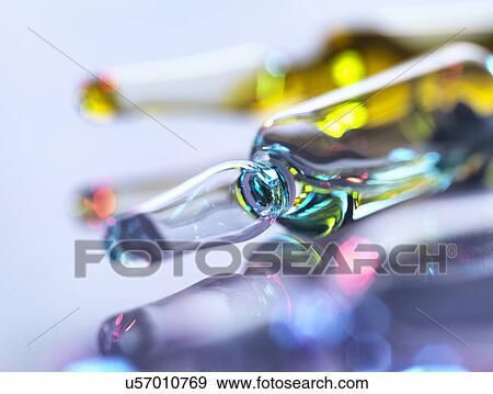 Stock Photo - Drug ampoules sitting in tray awaiting injection. Fotosearch