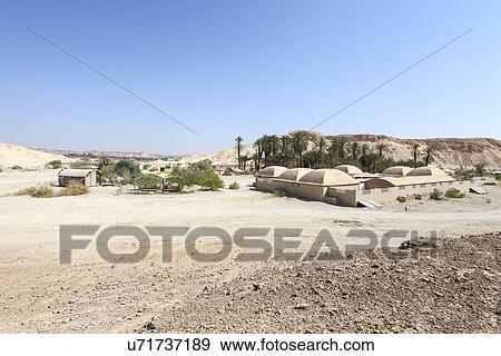 Stock Photo - Ecological buildings around an oasis, Negev Desert, Israel. Fotosearch