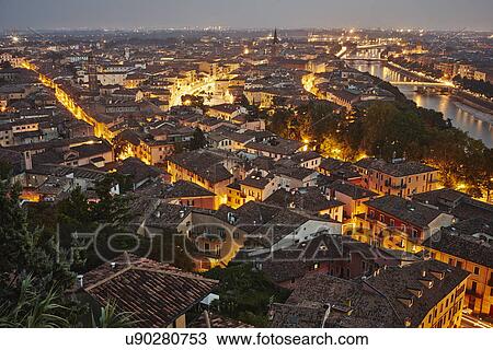 Stock Image - Elevated view of Verona, Italy, at dusk. Fotosearch