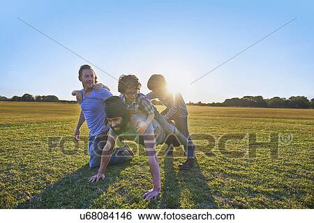Stock Photograph - Family enjoying outdoor activities in the park. Fotosearch