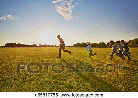 Family enjoying outdoor activities in the park View Large Photo Image Stock Photography - Family enjoying outdoor activities in the park. Fotosearch