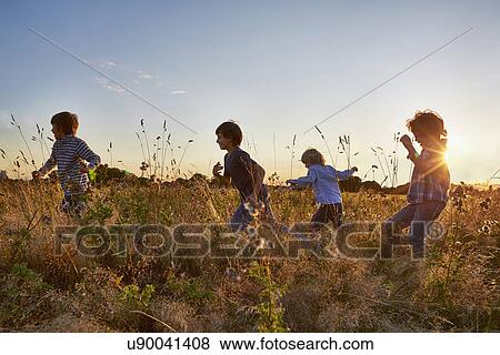 Stock Photo - Family out walking in the park. Fotosearch