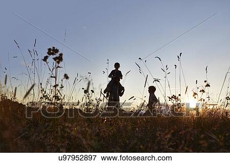 Family out walking in the park View Large Photo Image Stock Photo - Family out walking in the park. Fotosearch
