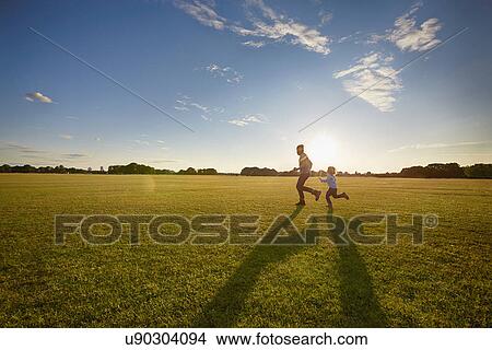 Father and son out in the park View Large Photo Image Picture - Father and son out in the park. Fotosearch