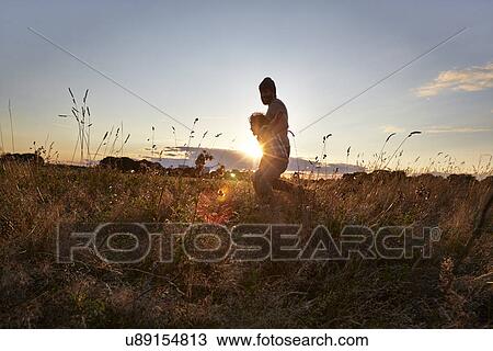 Father and son out walking in the park View Large Photo Image Stock Image - Father and son out walking in the park. Fotosearch