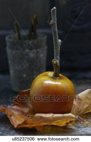 Stock Photograph - Freshly made toffee apple, close-up. Fotosearch