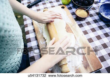 Girl rolling pastry View Large Photo Image Stock Image - Girl rolling pastry. Fotosearch