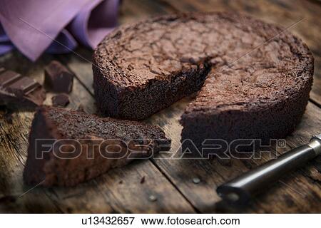 Gluten free chocolate cake on kitchen table View Large Photo Image Stock Photo - Gluten free chocolate cake on kitchen table. Fotosearch