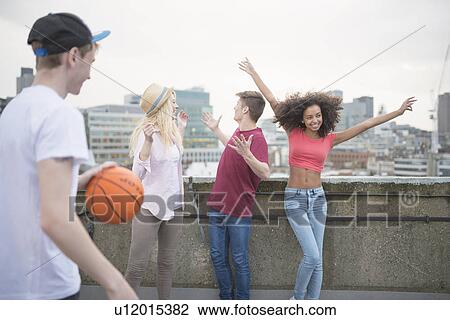 Group of friends dancing, boy with basketball View Large Photo Image Stock Image - Group of friends dancing, boy with basketball. Fotosearch