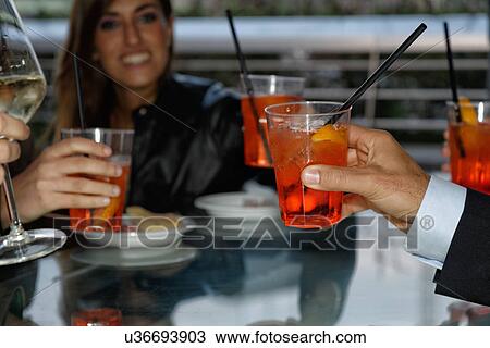 Group of friends making toast View Large Photo Image Stock Image - Group of friends making toast. Fotosearch