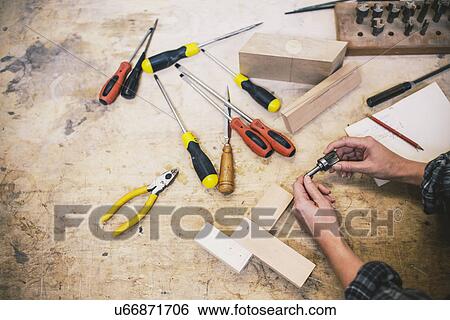 Hands of young craftswoman holding component in pipe organ workshop View Large Photo Image Stock Photograph - Hands of young craftswoman holding component in pipe organ workshop. Fotosearch
