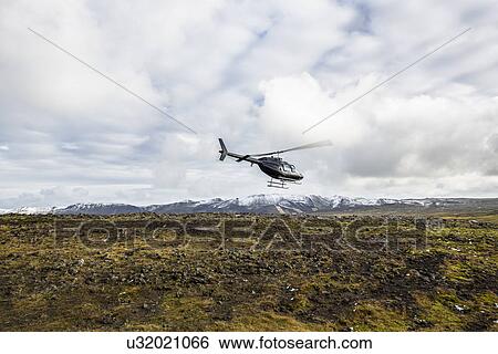 Stock Photograph - Helicopter flying over Blafjoll, Iceland. Fotosearch