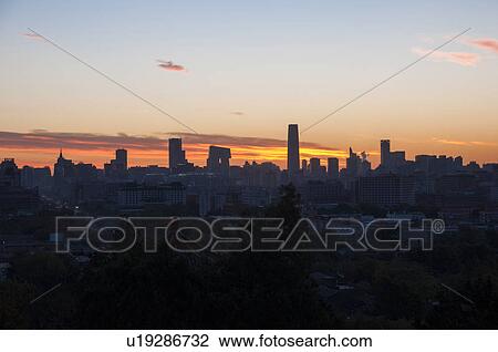 Stock Image - High angle view of CBD area at sunset, Beijing, China. Fotosearch