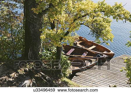 High angle view of rowing boats and pier, Lake Bled, Slovenia View Large Photo Image Stock Photo - High angle view of rowing boats and pier, Lake Bled, Slovenia. Fotosearch