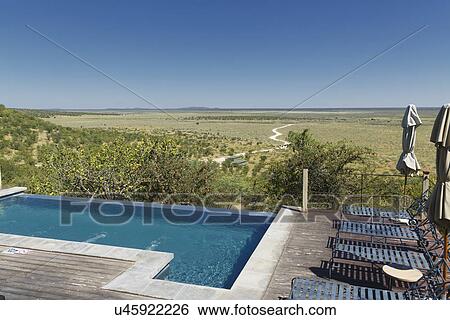 Infinity pool and sun loungers at Dolomite camp, Etosha National Park, Namibia View Large Photo Image Stock Photograph - Infinity pool and sun loungers at Dolomite camp, Etosha National Park, Namibia. Fotosearch