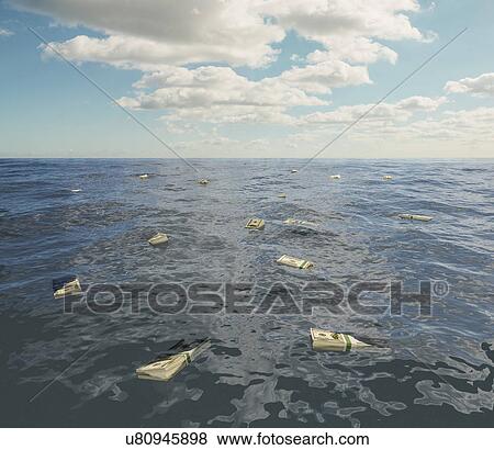 Stock Photo - Large group of one hundred dollar bill stacks floating on surface of sea. Fotosearch