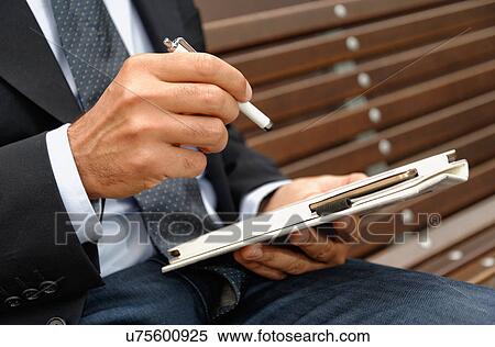 Man using digital tablet and stylus, focus on hands View Large Photo Image Stock Photography - Man using digital tablet and stylus, focus on hands. Fotosearch