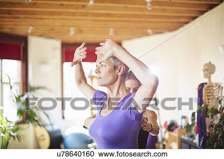 Mature female student and tutor in pilates gym View Large Photo Image Stock Image - Mature female student and tutor in pilates gym. Fotosearch