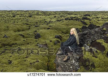 Mid adult woman sitting on rocks, looking at view, Blafjoll, Iceland View Large Photo Image Stock Image - Mid adult woman sitting on rocks, looking at view, Blafjoll, Iceland. Fotosearch