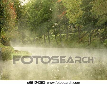 Stock Image - Morning mists on Royal Canal, Ireland. Fotosearch
