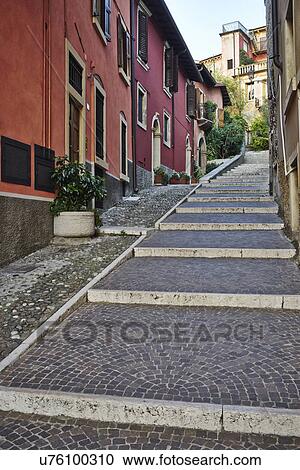 Stock Image - Narrow street with steps, Verona, Italy. Fotosearch