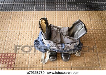 Overalls and boots on floor of fire station View Large Photo Image Stock Photo - Overalls and boots on floor of fire station. Fotosearch