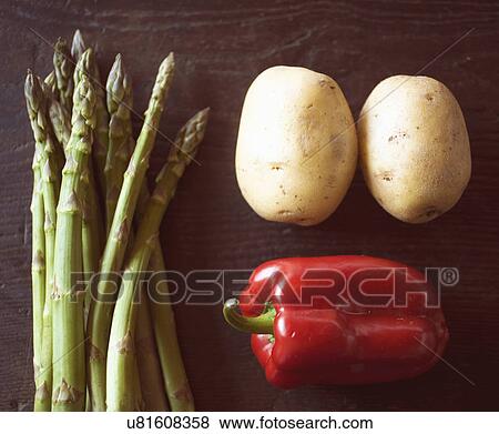 Overhead view of fresh asparagus, potatoes and red pepper on table View Large Photo Image Stock Photo - Overhead view of fresh asparagus, potatoes and red pepper on table. Fotosearch