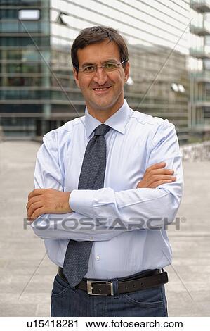 Portrait of man, arms crossed View Large Photo Image Stock Image - Portrait of man, arms crossed. Fotosearch