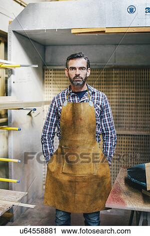 Portrait of mature craftsman in organ workshop View Large Photo Image Stock Image - Portrait of mature craftsman in organ workshop. Fotosearch