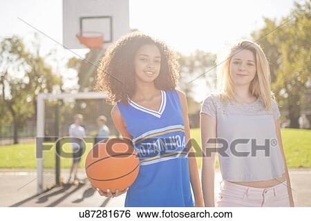 Portrait of two young female basketball players View Large Photo Image Stock Photograph - Portrait of two young female basketball players. Fotosearch