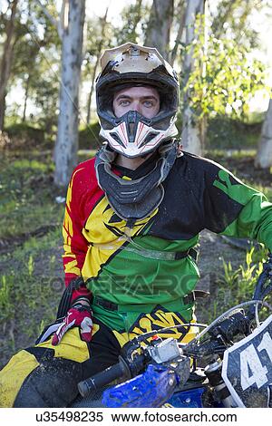 Portrait of young male motocross racer in forest View Large Photo Image Stock Photography - Portrait of young male motocross racer in forest. Fotosearch