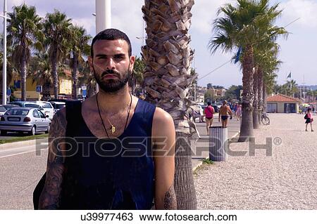 Portrait of young man on beach, Marseille, France View Large Photo Image Stock Image - Portrait of young man on beach, Marseille, France. Fotosearch