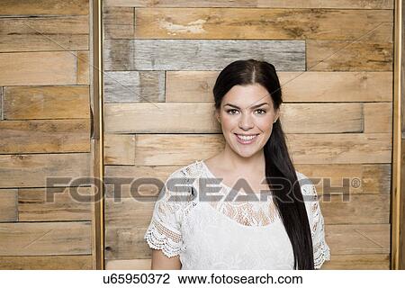 Portrait of young seamstress in front of workshop wall View Large Photo Image Stock Image - Portrait of young seamstress in front of workshop wall. Fotosearch