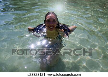 Portrait of young woman swimming in sea, Marseille, France View Large Photo Image Stock Image - Portrait of young woman swimming in sea, Marseille, France. Fotosearch