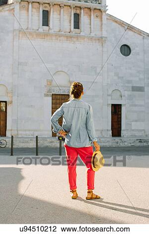 Rear view of mid adult woman looking up at church, Tuscany, Italy View Large Photo Image Stock Image - Rear view of mid adult woman looking up at church, Tuscany, Italy. Fotosearch