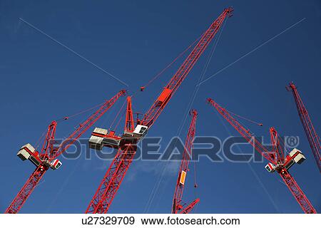 Red construction cranes View Large Photo Image Stock Photo - Red construction cranes. Fotosearch